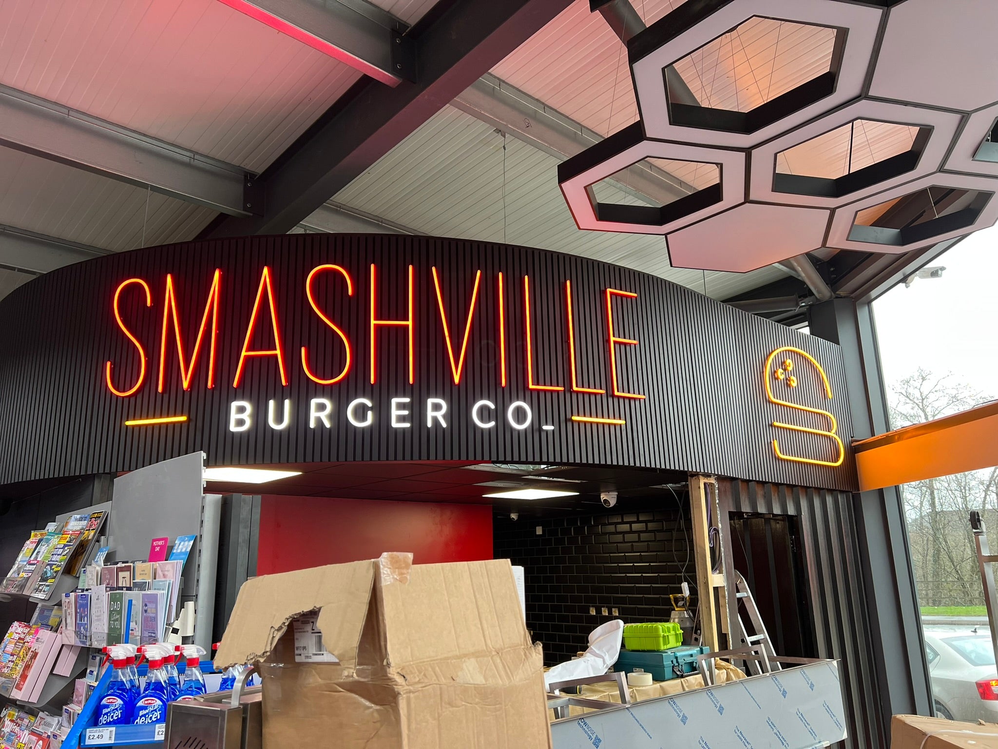 Completed Smashville Burger Co. curved fascia with black slatted cladding and illuminated Faux Neon lettering.