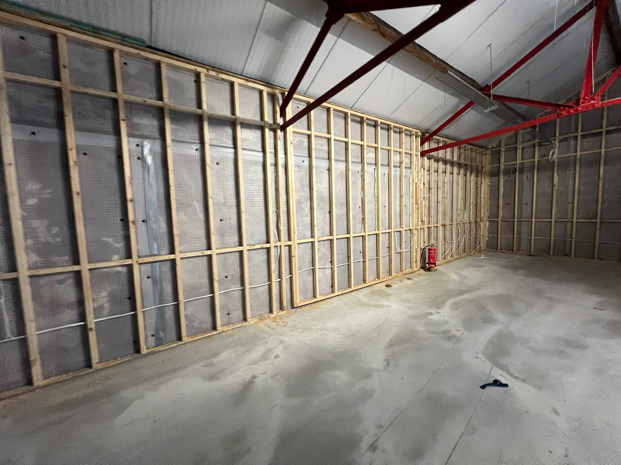 Open commercial shell during the early stages of the YOH Burger restaurant and kitchen fit-out.