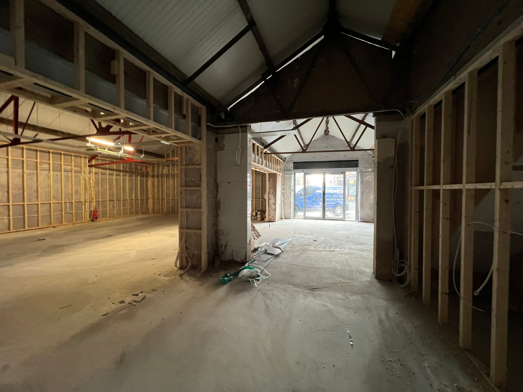 Unfinished back-of-house area before the installation of the YOH Burger commercial kitchen.