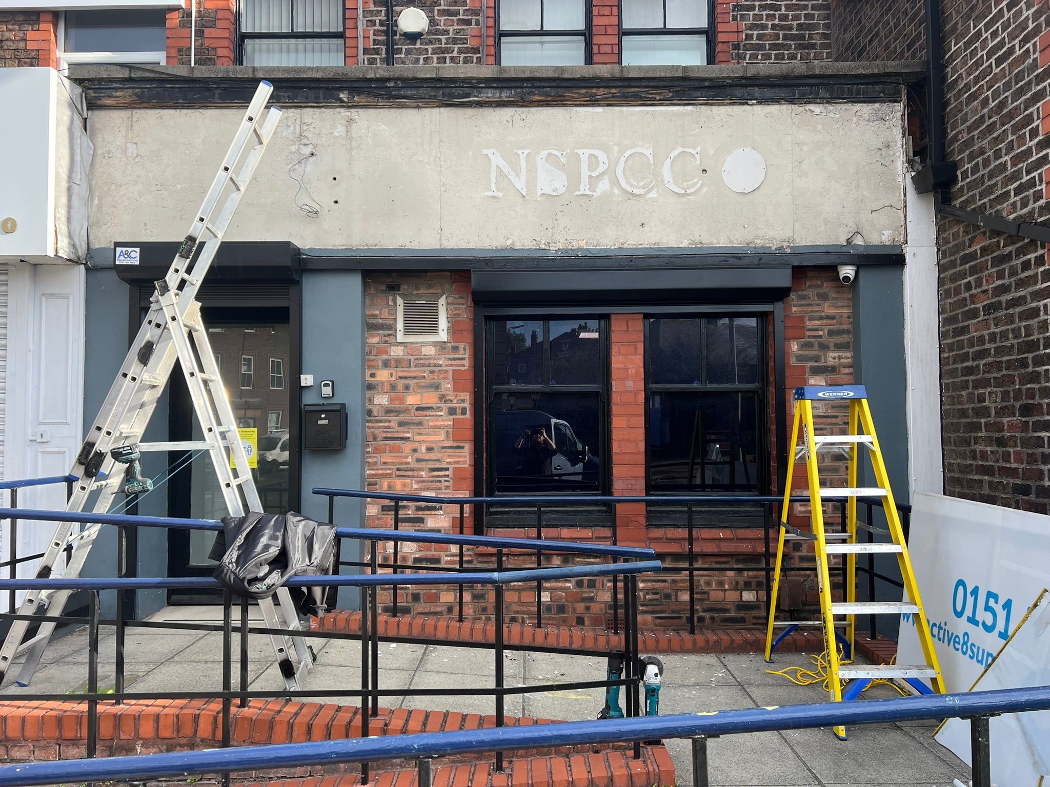 Weathered commercial property fascia before the installation of new Active8 Support Services signage.