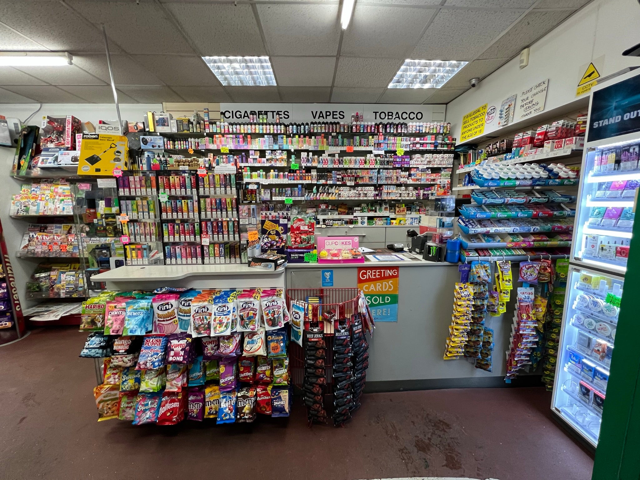 Outwood Express shop counter and crowded vape display area before the bespoke retail refurbishment.