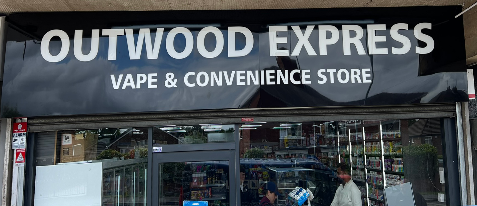 Outwood Express shopfront following installation of new black and white fascia signage